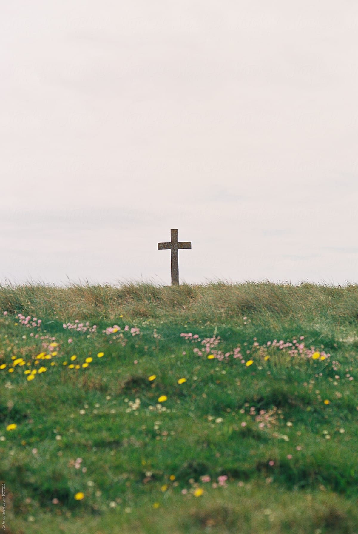 Cross By The Sea Side” by Stocksy Contributor  “Lea Jones